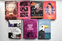 Okładki nowości książkowych na parapecie.