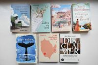 Okładki nowości książkowych na parapecie.